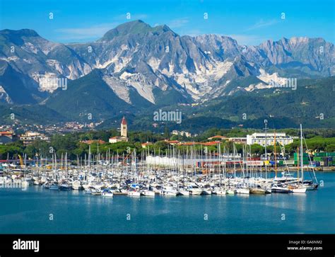 Marina di Carrara with the backdrop of the Apuane mountains on the ...