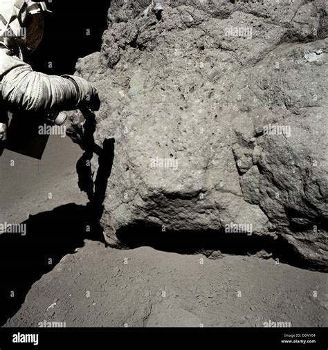 An Apollo 17 Astronaut Examines and Takes Samples From a Moon Rock ...