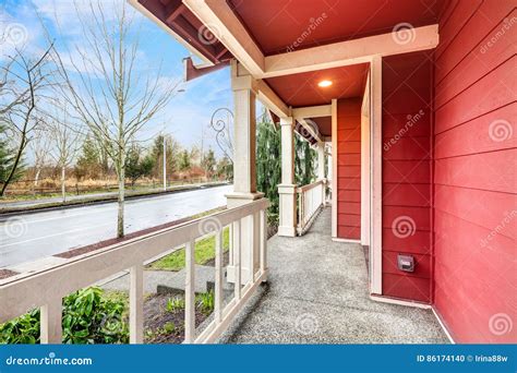 Covered Red Front Porch with Railings Stock Photo - Image of modern, outside: 86174140