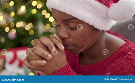 African American Woman Celebrating Christmas Praying at Home Stock ...