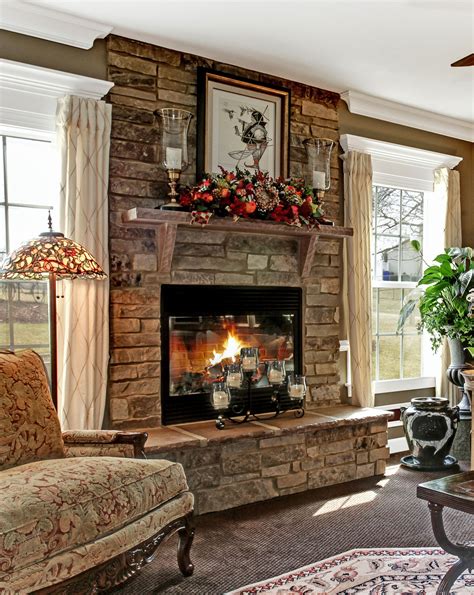 A stone fireplace adds a rustic element to an elegant room, making it a warm, inviting s ...