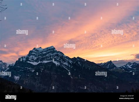 colorful sunset with mountains in swiss alps Stock Photo - Alamy