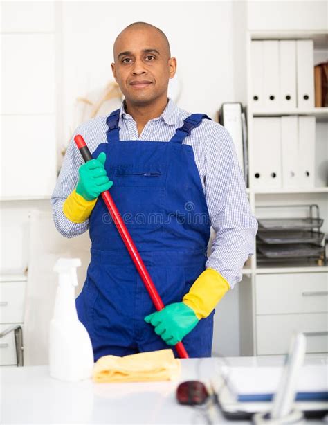 Cleaner in Protective Uniform at Company Office Stock Photo - Image of ...