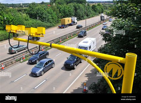 Aerial view motorists driving along M25 motorway road variable average ...