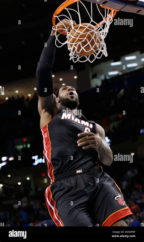 Miami Heat forward LeBron James (6) dunks during the first quarter of ...