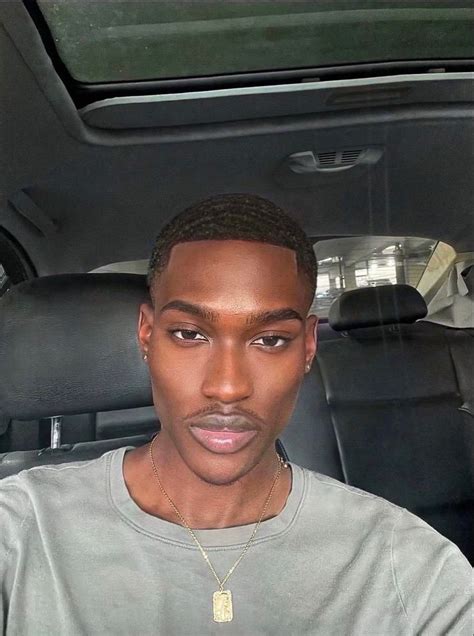 man sitting down in car wearing all gray. Cheekbones and jawline visible Fine Black Men, Black ...