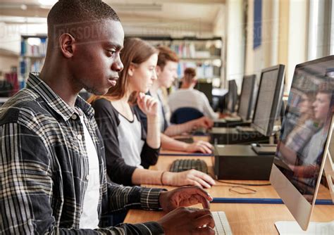 Group Of Students Using Computers In College Library - Stock Photo - Dissolve