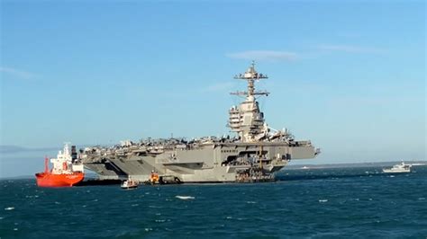 Huge warship USS Gerald R Ford moors off south coast of England