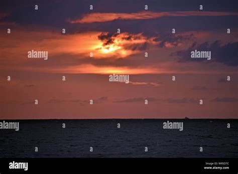 Red Sunset at the Beach Stock Photo - Alamy