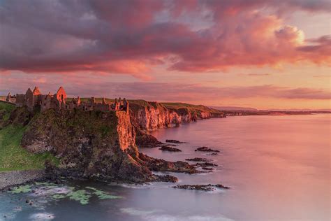 Dunluce Castle Sunset, Co Antrim, Northern Ireland Photograph by Adrian ...