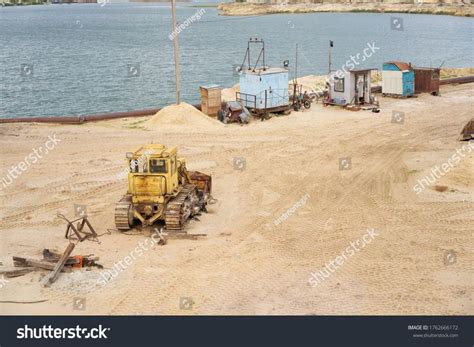 Sand quarry mining industry equipment excavator tractor standing sand ...