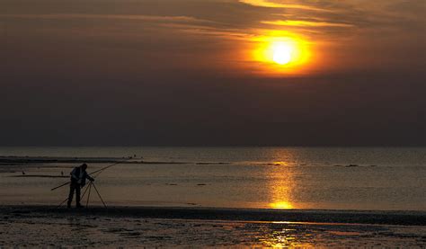 Man fishing at sunset Photograph by Thanet Photos | Fine Art America