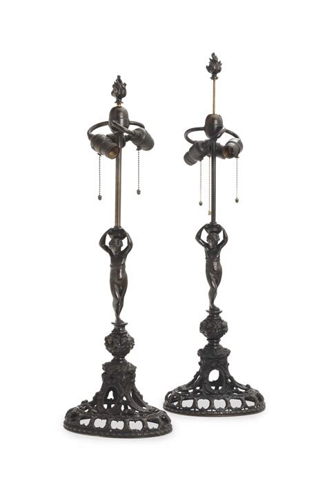 A PAIR OF RENAISSANCE STYLE PATINATED BRONZE LAMPS