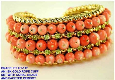 Gorgeous Tony Duquette 18k gold rope cuff set with coral beads and peridot. LOVE!