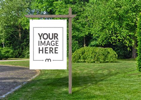 Large Yard Sign Mockup on Wooden Pole in Green Grass - Mediamodifier