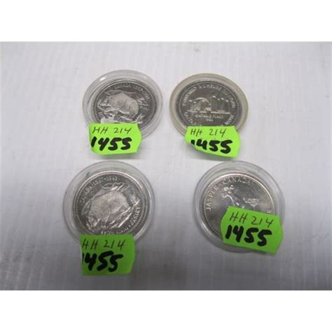 4 COLLECTABLE CANADIAN DOLLAR COINS - Dodds Auction