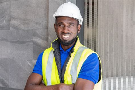 Selective focus at face of Black African foreman at building ...