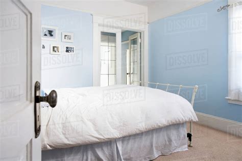 Open door to bedroom - Stock Photo - Dissolve