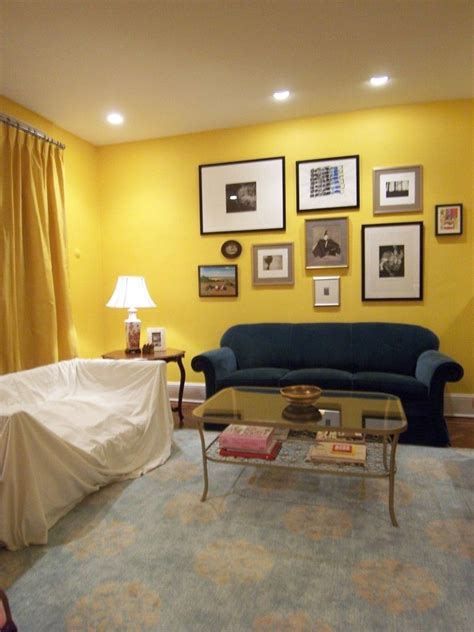 Yellow walls, blue couch | Yellow walls living room, Yellow living room furniture, Yellow living ...