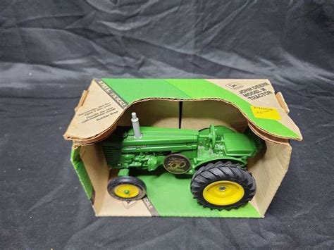 (2)-1/16th Ertl John Deere Wide Front Tractors - Aumann Auctions, Inc.