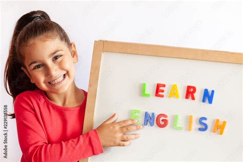 Language education concept. Learn English. Do you speak English. Cute little child girl with ...