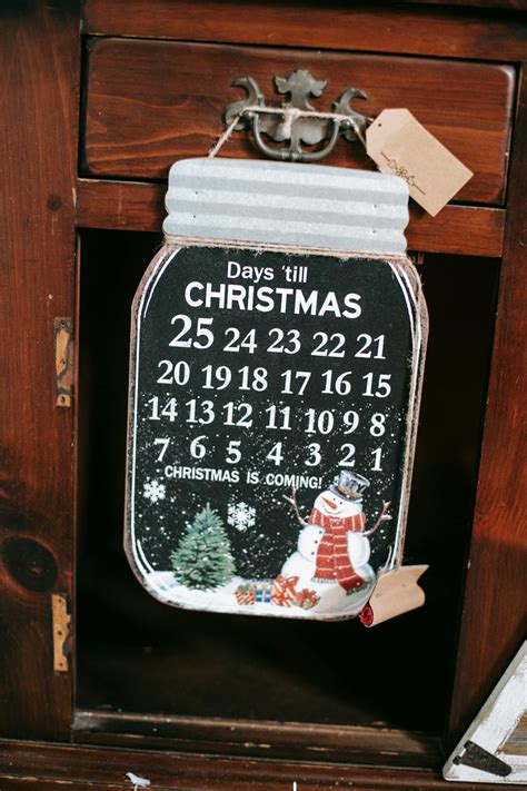 Decorative advent calendar with Christmas illustration in house · Free Stock Photo