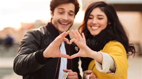 Romantic Couple Making Heart Shape with Hands Stock Image - Image of cute, gesture: 158754153