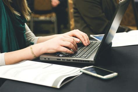 Woman Typing on Laptop · Free Stock Photo