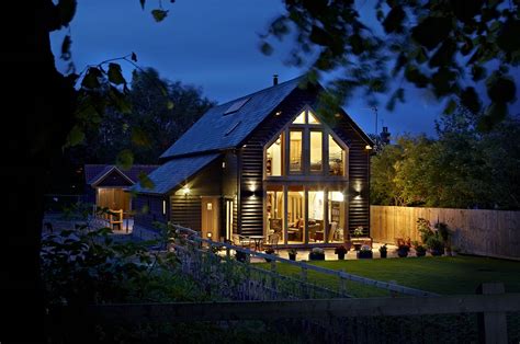 A charming yet modern black weatherboard barn-style home | Barn style house, Modern barn house ...
