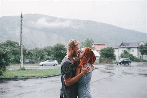 beautiful couple hugging in the rain 11779707 Stock Photo at Vecteezy