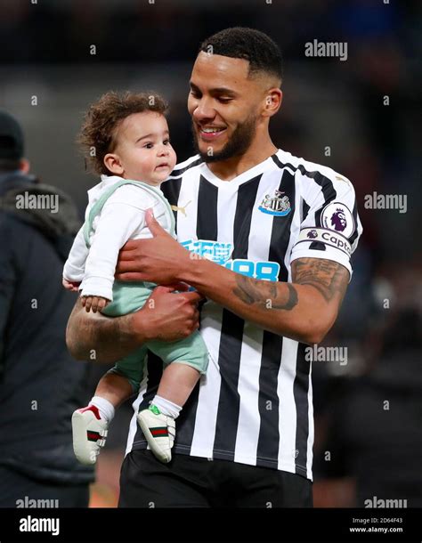 Newcastle United's Jamaal Lascelles and son Jamari Rai Lascelles on the pitch after the final ...