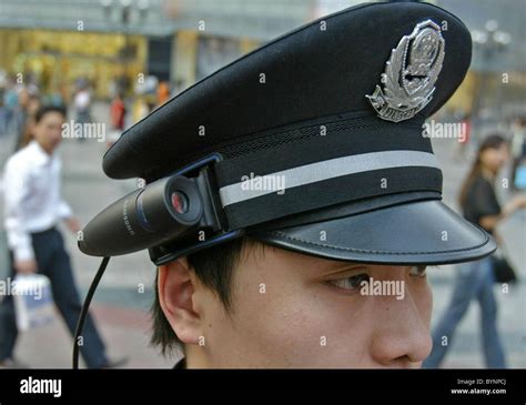 * POLICE CAMERA ACTION Chinese police get snap happy as they take their cameras out on patrol ...