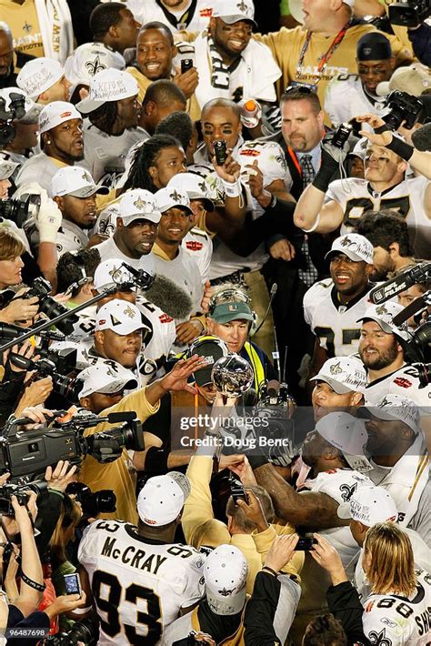 New Orleans Saints players celebrate with the Vince Lombardi Trophy ...