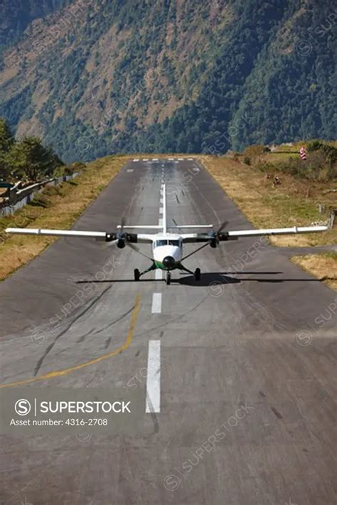 A Dornier 228 STOL (Short Takeoff and Landing) aircraft taxis after ...