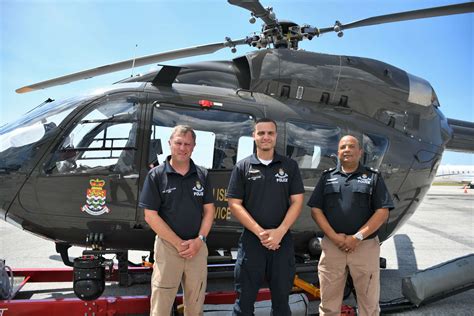 First Caymanian police helicopter pilot gets his wings - Cayman Compass