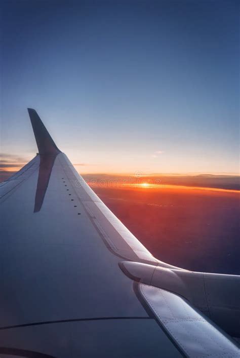 Airplane Wing during a Vibrant Sunset. Stock Photo - Image of outdoors ...