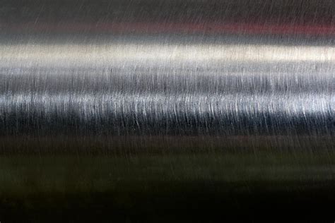 Texture of reflection on stainless steel pipe in dark room, abstract ...