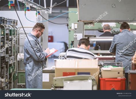 Manager Overlooking Shoe Factory Workers Concept Stock Photo 1014824794 | Shutterstock