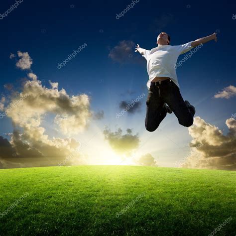 Jumping happy young man — Stock Photo © Iakov #4492841