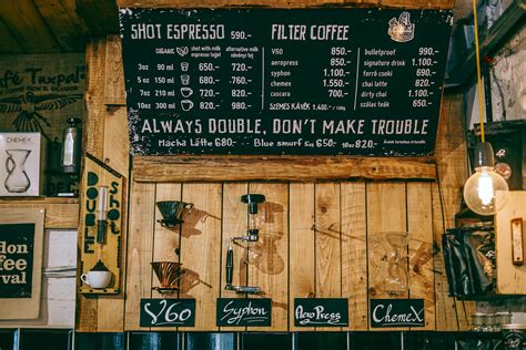 Cozy coffee house with creative decorated menu board · Free Stock Photo