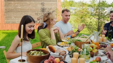 Happy Family Talking at a Dinner Table Free Stock Video Footage, Royalty-Free 4K & HD Video Clip