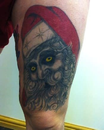 Demon Eyes - 25 Disturbing Christmas Tattoos | Complex