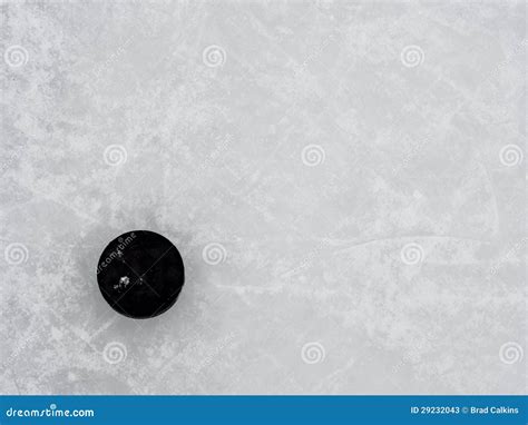 Hockey Puck On Ice Stock Photos - Image: 29232043