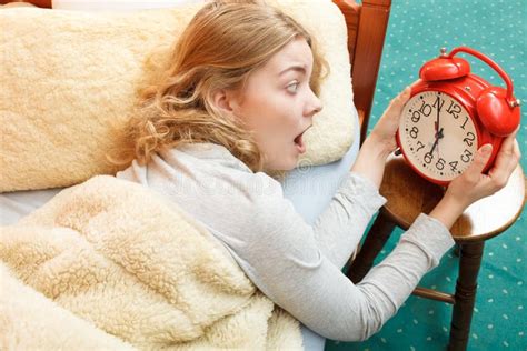 Woman Waking Up Late Turning Off Alarm Clock. Stock Photo - Image of ...