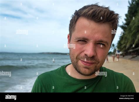 people facial expression concept . Close up portrait of smiling middle aged man face on sea or ...
