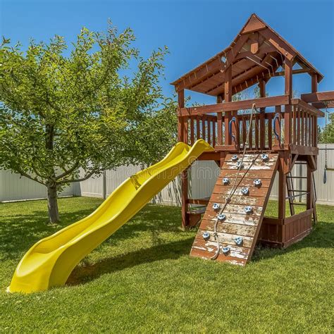 Square Frame Wooden Playground Structure with Yellow Plastic Slide Swings and Climbing Wall ...