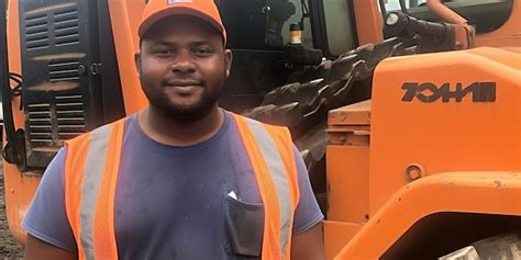 Premium AI Image | Worker standing in front of a bulldozer