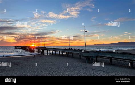 Colorful sunset lights up the beach, pier and ocean in Los Angeles Stock Photo - Alamy