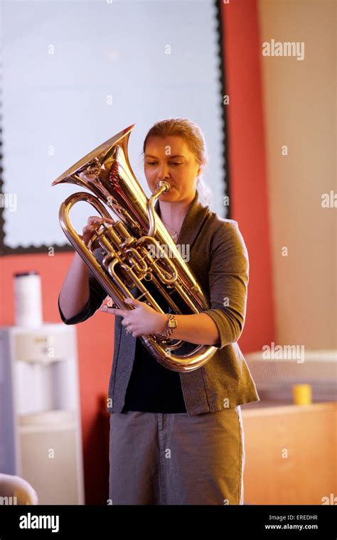 Euphonium player playing in a classroom Stock Photo - Alamy