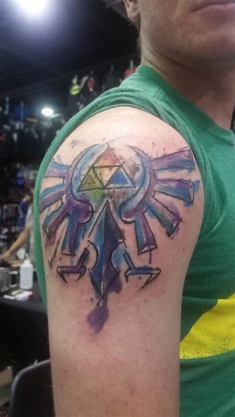 Hyrule crest water tattoo my friend got for his first tattoo! : r/gaming